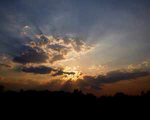 sun rays are striking through the clouds