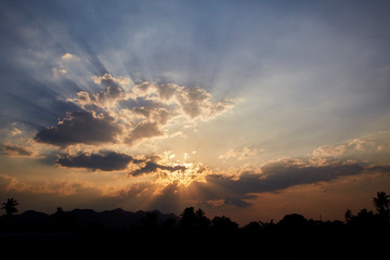sun rays are striking through the clouds