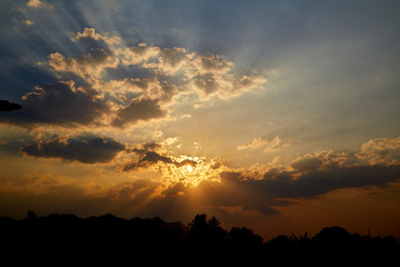 sun rays are striking through the clouds