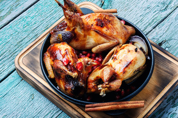 Quail fried in a frying pan