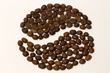 Roasted coffee beans isolated on white background.