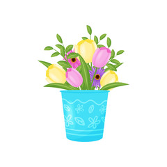 Flowers bouquet in blue vase on white background.