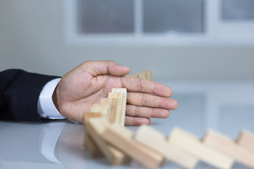 Stopping the domino effect concept for business solution, strategy and successful intervention