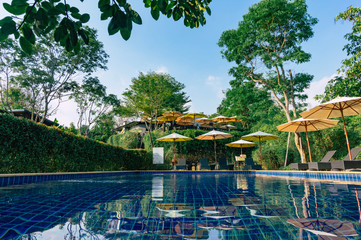 Fototapeta na wymiar Relaxing area beside swimming pool