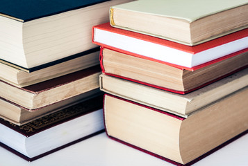 Stack of books education background, many books piles with copy space for text.