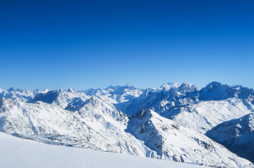 Fototapeta na wymiar Mountain range of Caucasian Mountains in the blue sky. Elbrus region
