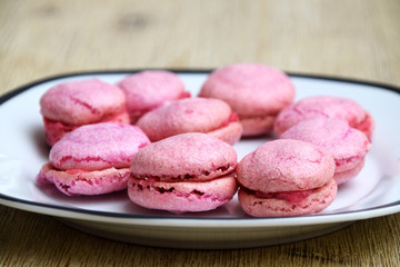 Home baked pink macarons with raspberry filling