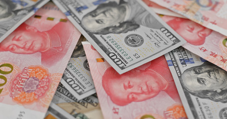 Obraz premium Stack of chinese RMB and USD banknote