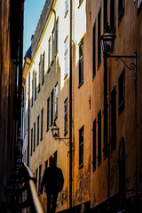 Fototapeta na wymiar Stockholm, Sweden Pedestrians on the back streets of Gamla Stan or Old Town.