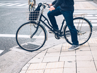 People riding Bicycle city street lifestyle Bike to work at Cross walk