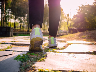 Woman Walking on trail in Park Jogging exercise Sport outdoor