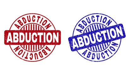 Grunge ABDUCTION round stamp seals isolated on a white background. Round seals with grunge texture in red and blue colors. Vector rubber imprint of ABDUCTION title inside circle form with stripes.