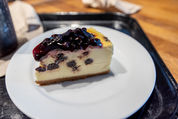 Blueberry cheese cake on the white plate