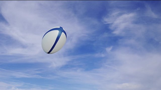 Rugby ball in rotation passing right to left in slow motion with alpha channel