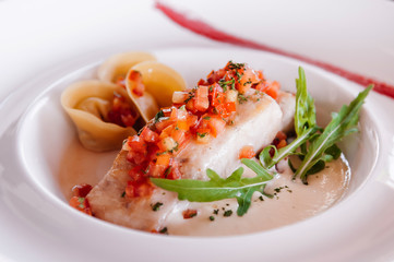 Grilled sea bass fillet with tortellini pasta