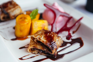 Chocolate crape with caramelized bananas and ice cream