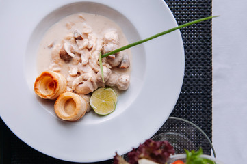 Chicken breast with creamy white wine mushroom sauce and puff pastry