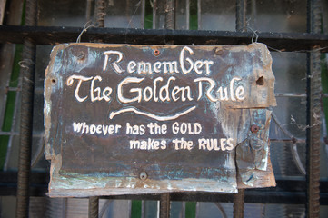 Remember the Golden Rule whoever has the gold makes the rules sign