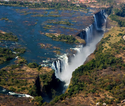 The Victoria falls is the largest curtain of water in the world. The falls and the surrounding area is the Mosi-oa-Tunya National Parks and World Heritage Site (helicopter view) - Zambia, Zimbabwe. Af © gudkovandrey