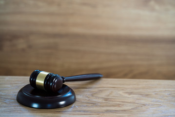 Law and justice concept image. Brown wooden background
