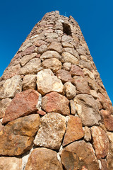Tower made of rocks with a small window at the top