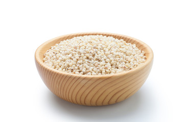 Sorghum rice in a wooden bowl isolated on white background