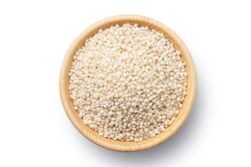 Sorghum rice in a wooden bowl isolated on white background. Top view.