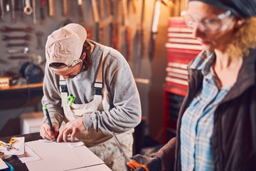 Couple working together in a retro vintage garage.