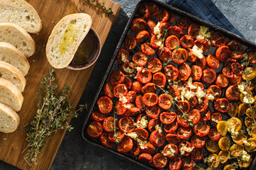 Baked cherry tomatoes in baking tray top view