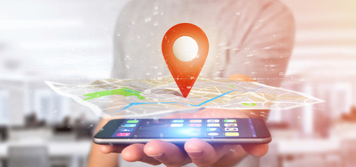 Man holding a 3d rendering pin holder on a map