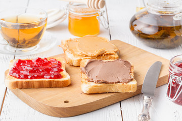 Delicious toast with sweet jam served for breakfast on table