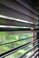 brown blind shade and mosquito wire screen on window, interior design decoration in home office