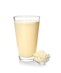 Glass of protein shake on white background