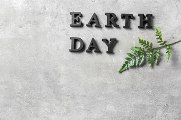 Text EARTH DAY on grunge background