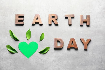 Text EARTH DAY on grey background