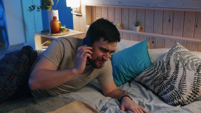 Guy laying in bed, covering slowly blanket. Time for sleeping. Young man falling asleep. Home. Comfort, coziness, bedroom, bedtime, disturbed, exhausted, frustrated, human, lifestyle, peace