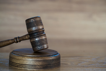 Law and justice concept image. Brown wooden background