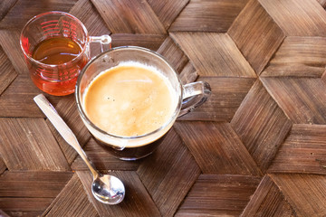Coffee cup with latte art foam on wood table in coffee shop with copy space.Coffee is one of the most popular beverages.Improve Energy Levels and Burn Fat