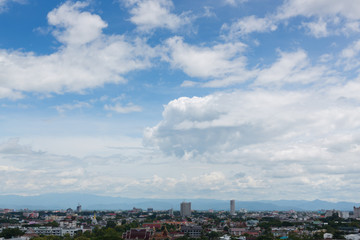 Fototapeta na wymiar white cloud on blue sky above the town, aerial view cityscape