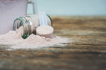 Double chocolate whey protein powder scoop nutrition healthy food bodybuilding.