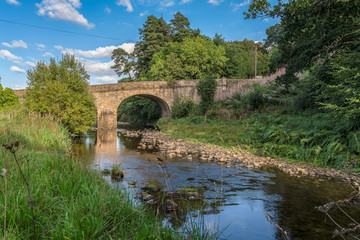 Stone bridge over the River Derwent in Blanchland, Northumberland, England, UK