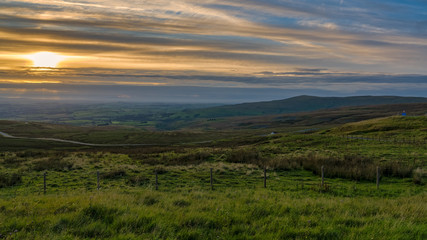 View over Greenfell Raise from Hartside Top on the A686 between Alston and Melmerby, Cumbria, England, UK - with the Lake District in the foggy background
