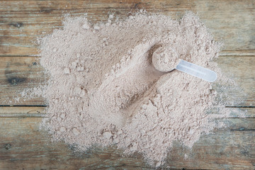 Double chocolate whey protein powder scoop nutrition healthy food bodybuilding.