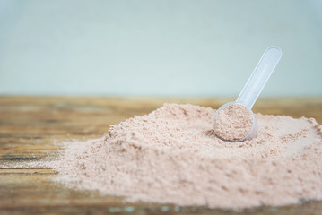Double chocolate whey protein powder scoop nutrition healthy food bodybuilding.