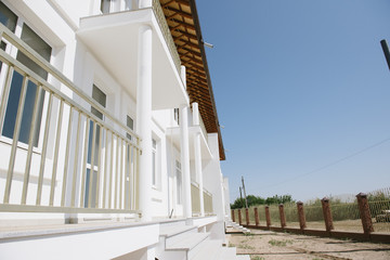 Large two-storey white country house