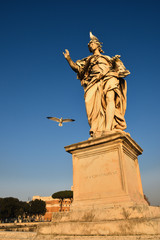 Fototapeta na wymiar Angel figure on the Aelian Bridge that leads to the Castle of the Holy Angel in Rome. 