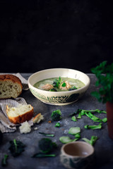 Broccoli  cream soup with salmon dumplings.selective focus