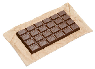 milk chocolate bar on craft packaging paper isolated on white background with clipping path