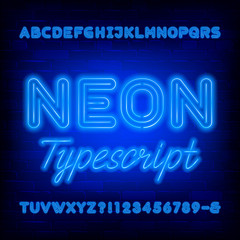 Obraz premium Blue neon alphabet font. Bold light bulb uppercase letters and numbers. Stock vector typeface for your typography design.