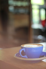 cup of coffee on wooden table